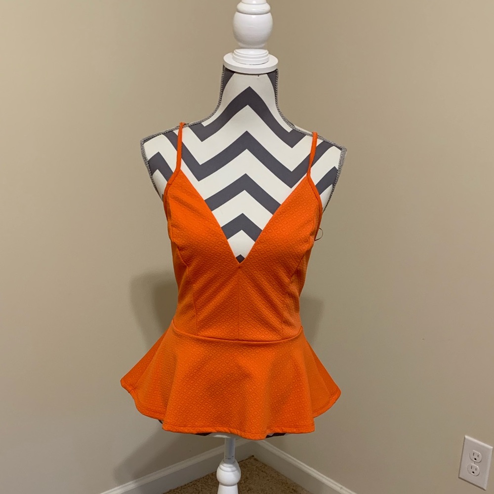 Plunging orange peplum top